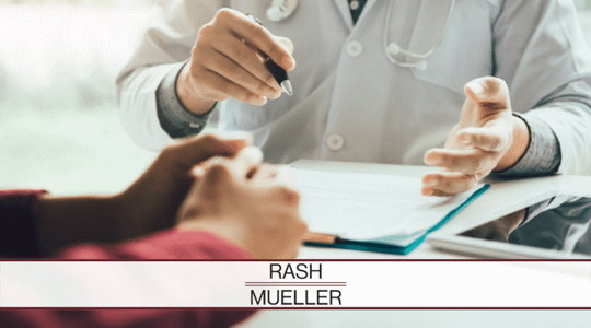 Doctor meeting with a patient in the doctor's office.